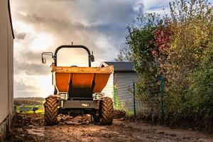 Dump truck to transport gravel to an earthmoving site photo