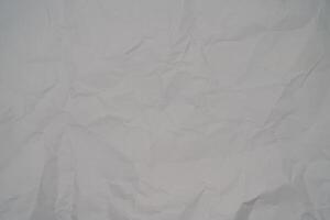 White Crumpled Paper Background. Abstract background for many uses photo