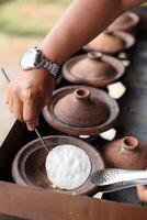 People Making Surabi Bandung Indonesian Traditional Pancakes photo