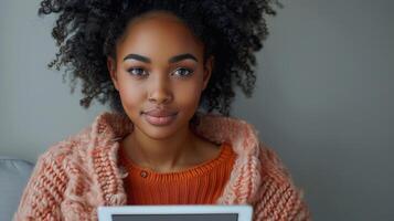 AI Generated A young African woman holding a digital tablet on a gray background, students using educational websites useful applications, freelancers doing remote work on the Internet photo