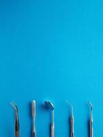 Dental tools on blue background photo
