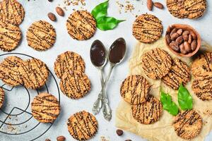 Oatmeal cookies with nuts and chocolate and gray stone background. Top view, space for text. photo