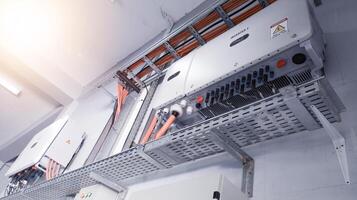 Instalation control of inverters solar panel on the wall. Technology of solar energy with shiny light. photo