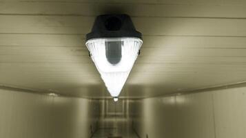 Close-up of a installation a long LED light bulb on the ceiling corridor room. photo