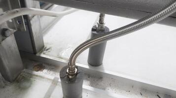 Water line flexible hose connect to cooling pipe with insulation pipe. photo