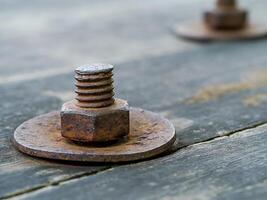 Old wooden panels with bolts and screws. photo