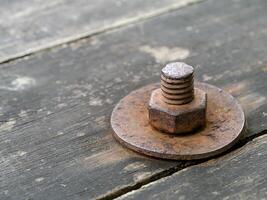 Old wooden panels with bolts and screws. photo