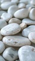 AI generated white pebbles, in the style of smooth and polished, monochromatic hues, poured resin, duckcore photo