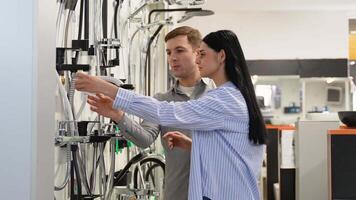 Bride and groom choosing a shower tap in a hardware store video