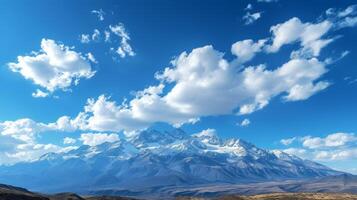 ai generado majestuoso montañas tapado con nieve, debajo un claro azul cielo con suave, blanco nubes foto