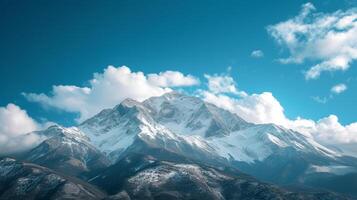 ai generado majestuoso montañas tapado con nieve, debajo un claro azul cielo con suave, blanco nubes foto