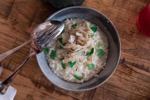 Creamy rice with old cheese, celeriac and truffle seen from above photo