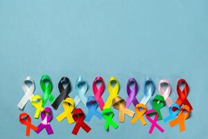 World Cancer Day. Colorful ribbons, cancer awareness, blue background. International Agency for Research on Cancer photo