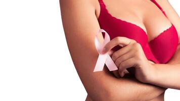 healthcare and medicine concept - woman with pink breast cancer awareness ribbon photo