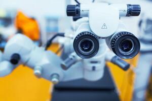 close up picture of an operating microscope in a laboratory. Ophthalmologist. medical, health, ophthalmology concept photo
