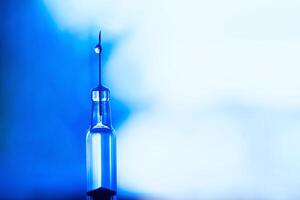 macro droplet on a syringe needle. anti-vaccinations photo