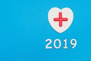 2019 New Year Red Cross symbol background concept. Copy space for text photo