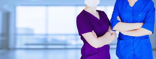 Impersonal portrait of a team performing surgery female doctor in front of a bright background photo