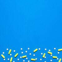 pharmaceutical medical blue background. Top view of the pills, ampoules, pills. Place for text photo