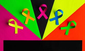 World cancer day background. Colorful ribbons, cancer awareness. photo