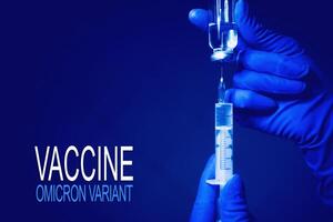 Syringe and hand closeup. The concept of vaccination, filling the drug into the syringe photo