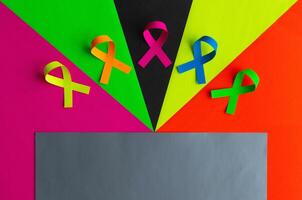 World cancer day background. Colorful ribbons, cancer awareness. photo