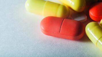 macro closeup colourful pills on white selective focus photo