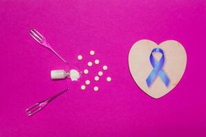 Testicular cancer concept. Bright background with ribbon of solidarity to the day of the fight against cancer. photo