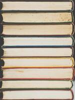 Background of multicolored roots of old books. Copy space. photo