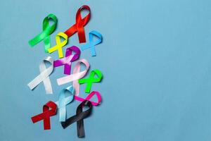 World Cancer Day. Colorful ribbons, cancer awareness, blue background. International Agency for Research on Cancer photo