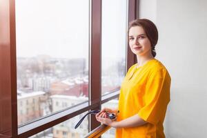 doctor beautiful girl in yellow uniform with stethoscope. Health care. background photo