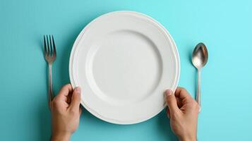 AI generated man putting empty plate with fork and spoon on blue table photo