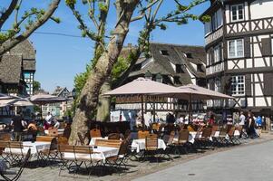 Strasbourg, France, 2017, Terrace with tourists in the Petite France district, Strasbourg, Alsace, Bas Rhin Department, France photo