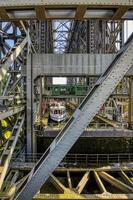 Excursion boat navigating in the old Niederfinow ship lift, Oder Havel Canal, Brandenburg, Germany photo