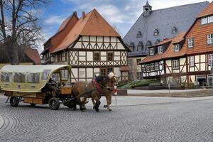 Wernigerode, Germany - 2023,  Horse-drawn cart in city center, Wernigerode, Harz, Saxony Anhalt, Germany photo