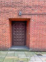 large secure door in a brick wall photo