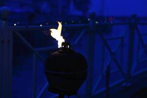 Burning oil lamp by the water in a relaxed atmosphere in Denmark. photo