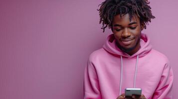 AI Generated On light purple background, teen model wearing pink hoodie using mobile digital apps on cellphone and texting on smartphone while wearing pink hoodie. photo