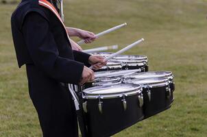 two marching band snare players warming up pregame photo