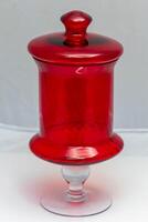 old red glass decanter on a white background photo