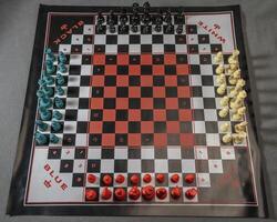 four person chess set all ready for a game photo