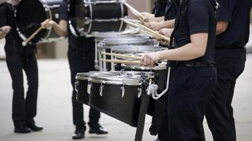 marching band drum line warming up for a parade photo