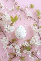 AI generated Spring Blossom and Polka Dot Egg on Soft Pastel Background. Charming Easter Egg Concept with Copy Space in Flat Lay. photo