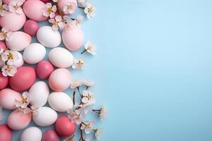 AI generated Top view colorful easter egg with cherry blossom on blue background, copy space, generative Al. photo