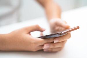 Teenage using social media with mobile phone, chat, website, shopping online. photo