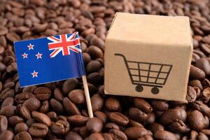 New Zealand flag with shopping cart on coffee bean, import export trade online commerce concept. photo