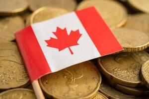 Canada flag on coins money, finance and accounting, banking concept. photo