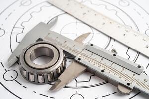 Engineering tools and mechanical industrial with vernier caliper and metal ball bering. photo