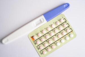 Pregnancy test and birth control pills, contraception health and medicine. photo