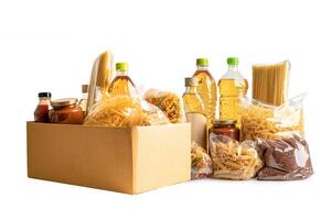 Foodstuff for donation isolated on white background with clipping path, storage and delivery. Various food, pasta, cooking oil and canned food in cardboard box. photo